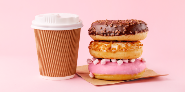 Coffee And Donuts On Pink Background